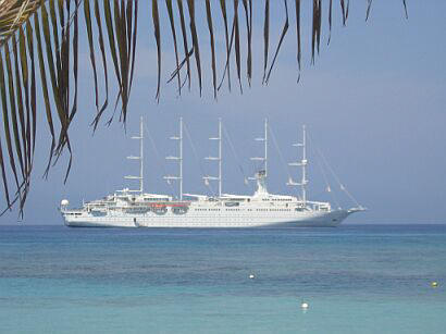 Windstar sailing ship at anchor in turquoise water